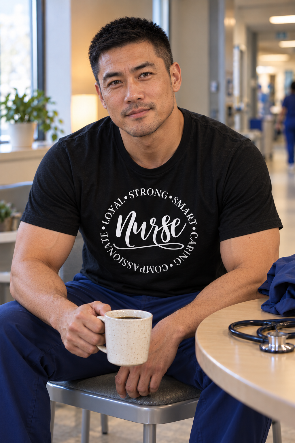 Rugged Chinese male nurse sitting forward during a coffee break in a black Nurse qualities T-shirt